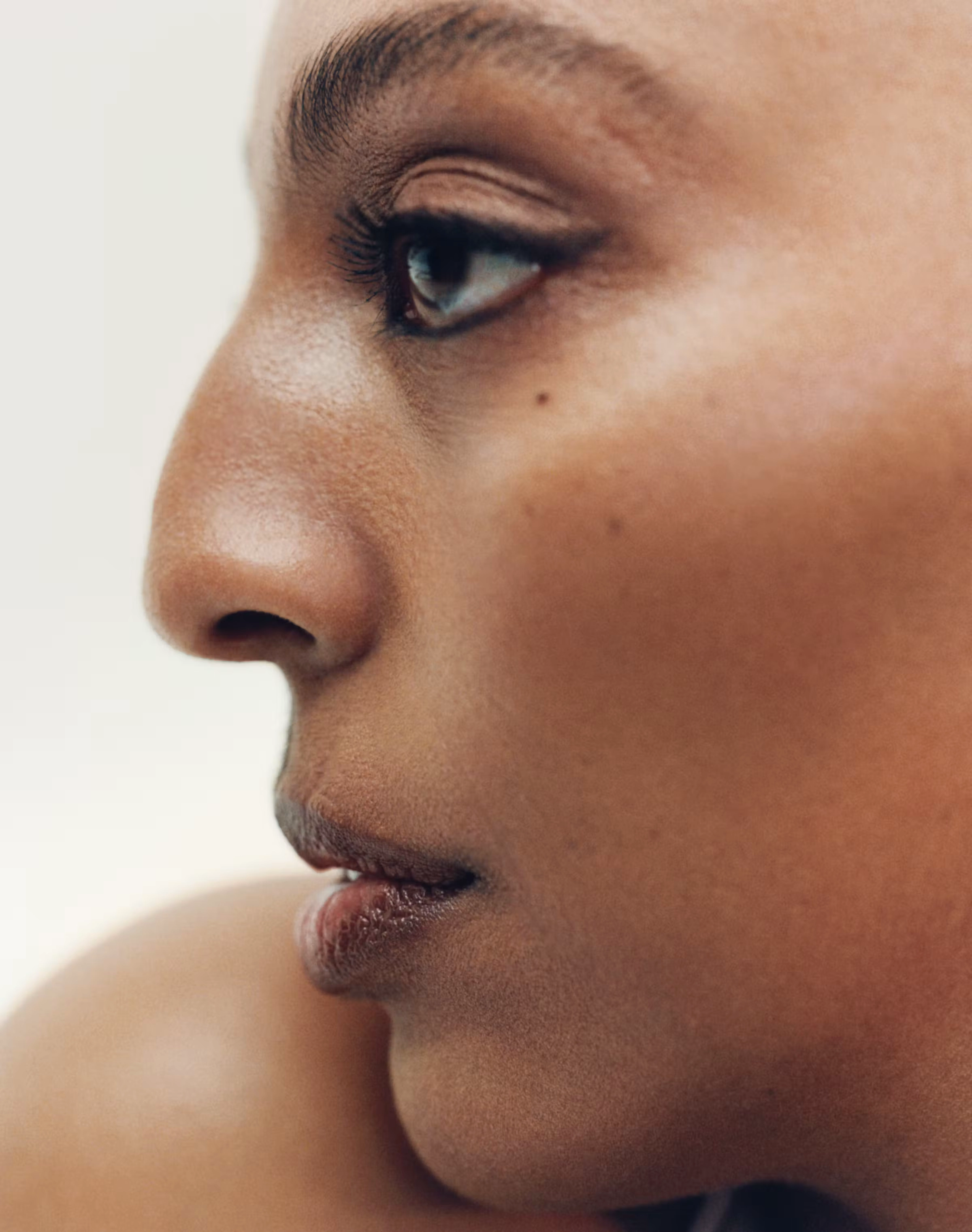 Side portrait of a person with glowing skin, from the About page