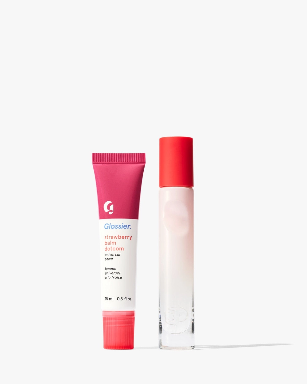 Travel spray and a red lip balm tube standing together