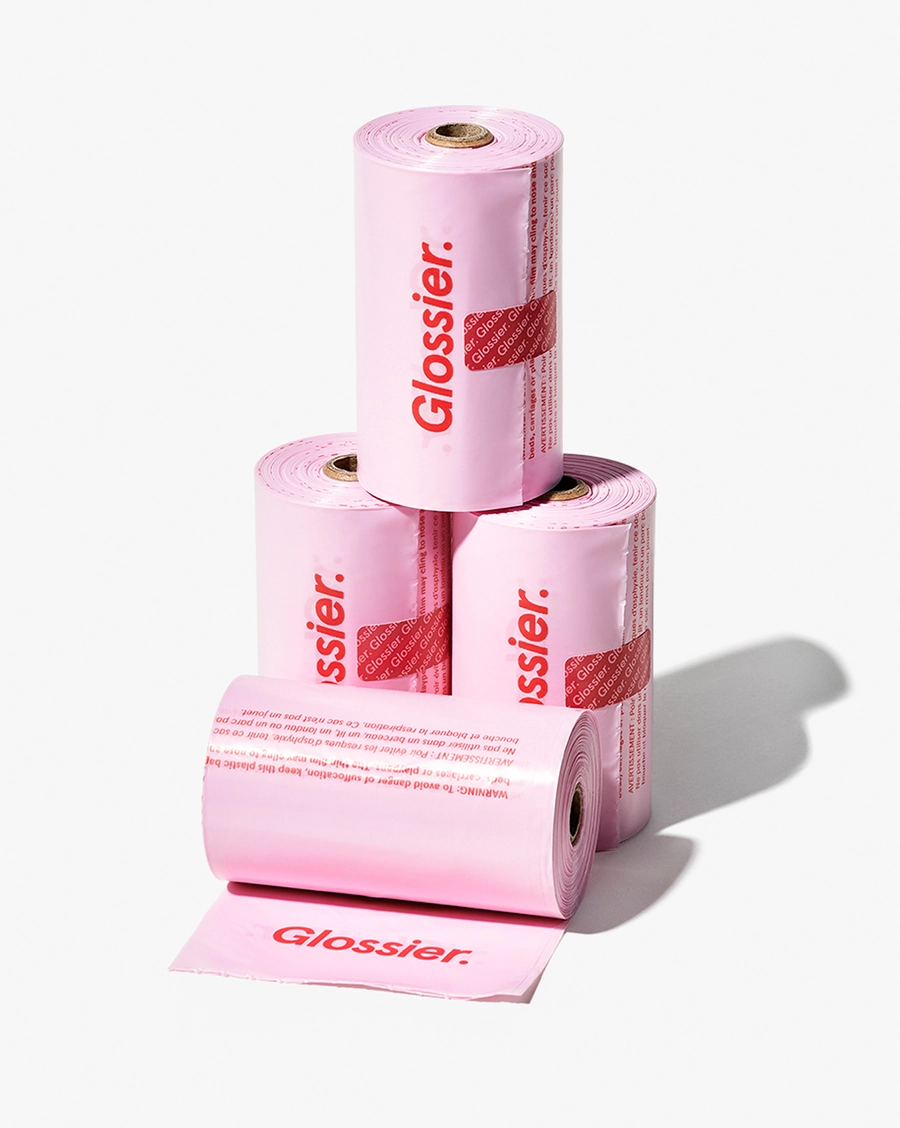 Smile Wave Pet Waste Bags: a stack of pink rolls